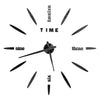 A black and white modern 3D acrylic wall clock with DIY sticker numbers showing the time.