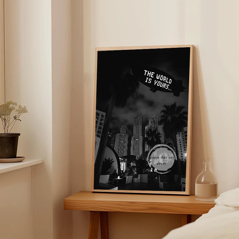 A framed canvas wall art featuring a silhouette of Tony Montana and the text The World Is Yours on a dark background.