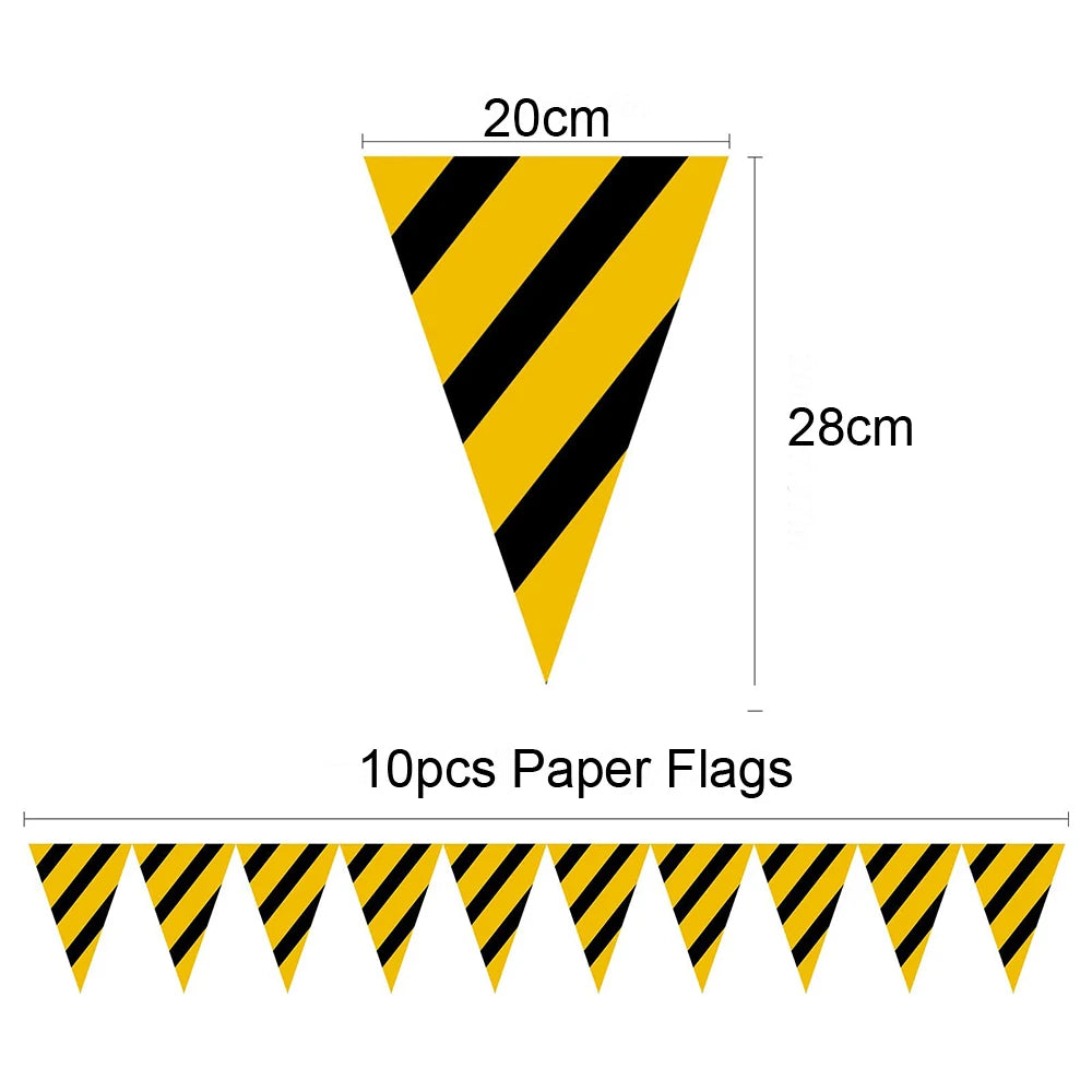 A set of ten black and yellow striped paper flags for a construction vehicle themed party.