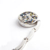 Silver foldable handbag hook with a floral patterned round plate and a curved metal handle.
