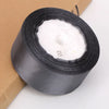Roll of white satin ribbon for crafts and gift wrapping, packaged in brown paper.
