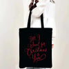 Black tote bag with pink script text that reads All I want for Christmas is you