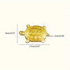 Runde, goldene Geld-Schildkrötenfigur mit strukturierter Oberfläche und Maßenangaben.