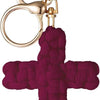A deep magenta woven cross keychain with a gold-toned split ring and clasp.