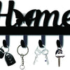 Decorative metal wall-mounted key holder with seven hooks and various keys.