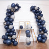 A display of blue and gray latex balloons arranged in vertical columns for party decorations.