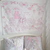 A white tapestry wall hanging featuring a sweet dream theme with cute cartoon characters and pink accents for bedroom decor
