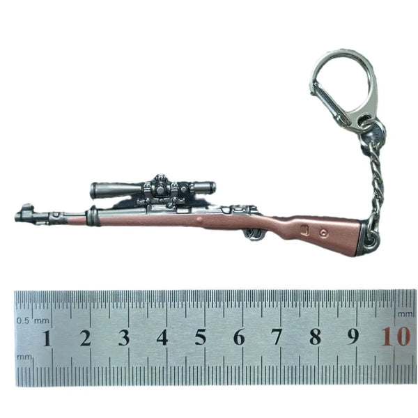 A realistic miniature alloy gun model keychain with a metal loop and a detailed firearm replica.