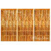 Three panels of vertical metallic gold foil fringe curtains used for party backdrop decor