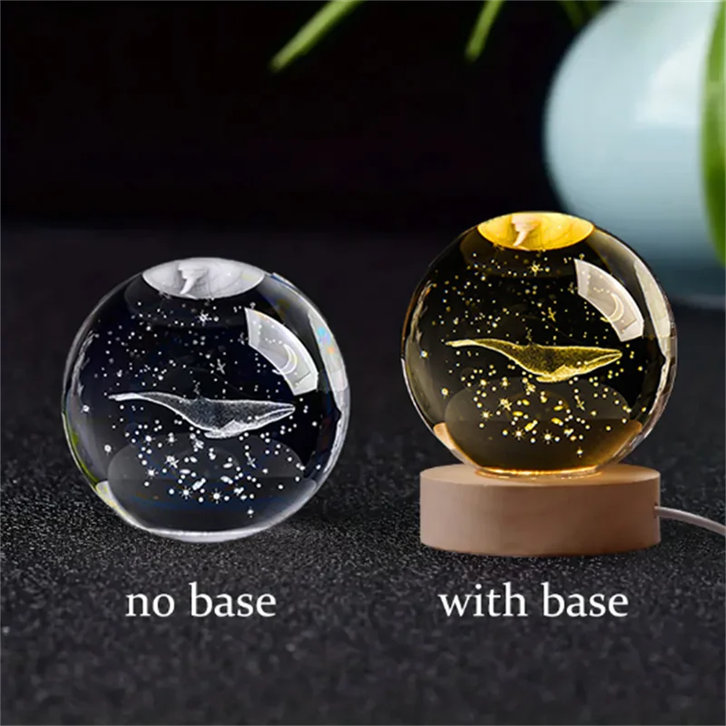 A comparison of a 3D crystal ball night light, shown without a base and with a wooden base.