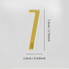 A polished gold house number seven with a self-adhesive backing.