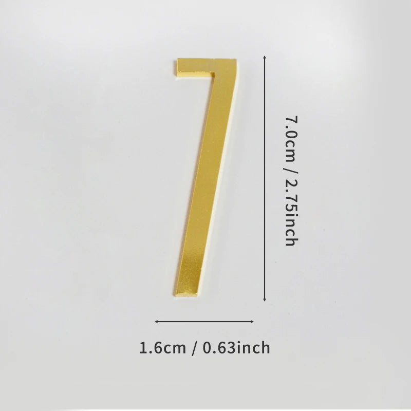 A polished gold house number seven with a self-adhesive backing.