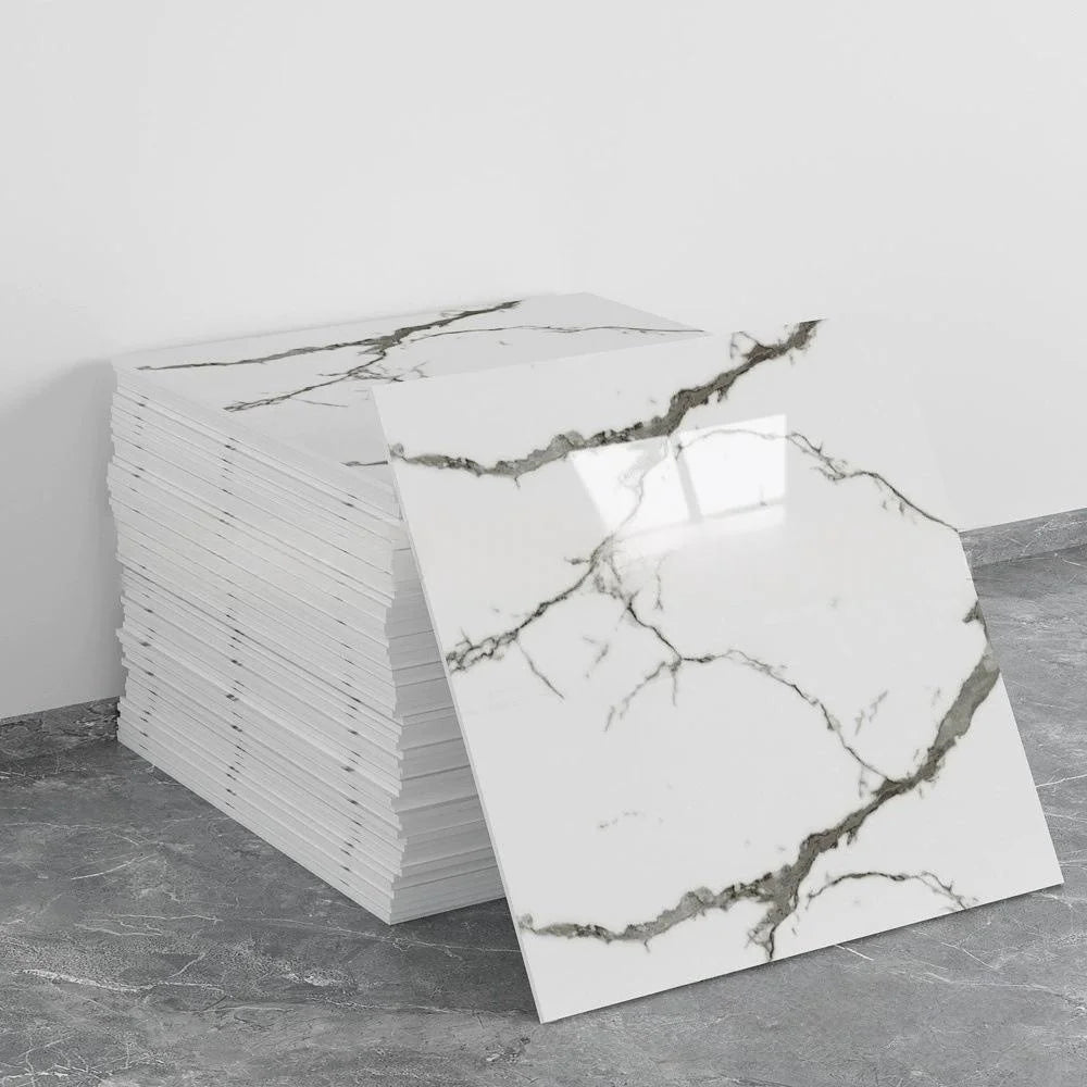 A stack of white marble tile stickers with gray veining displayed on a gray floor.