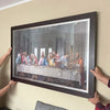 A framed print depicting The Last Supper, a Renaissance masterpiece painting on canvas.