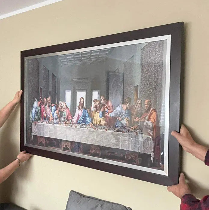 A framed print depicting The Last Supper, a Renaissance masterpiece painting on canvas.