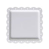A white decorative food tray with a scalloped edge and square insert.