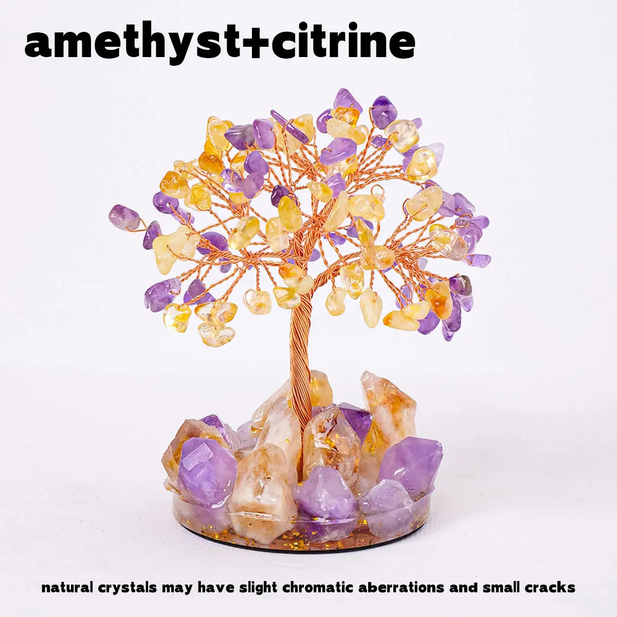 A crystal tree featuring amethyst and citrine crystals on a stand.