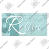 A rustic wooden sign with white script text that reads They See Me Rollin