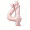 A large pink foil number balloon shaped like the number 4 with a bow.