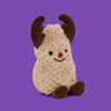 A fluffy beige plush toy resembling a reindeer with brown antlers and a small red nose.