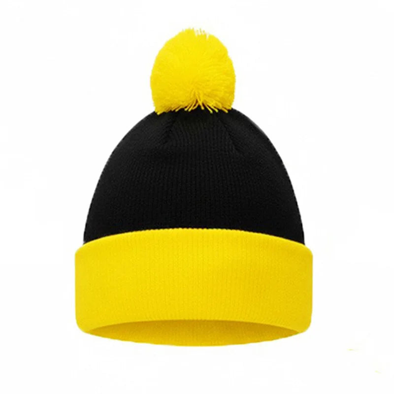 A black knitted beanie with a yellow pom-pom and a matching yellow cuff.
