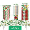 A set of tropical hibiscus tableware including 7 inch plates, cups, and napkins displayed on a tablecloth.