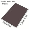 A glossy printable magnetic sheet measuring 11.7 inches by 8.3 inches.
