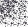 A pile of realistic mini plastic spiders for Halloween decor and pranks.