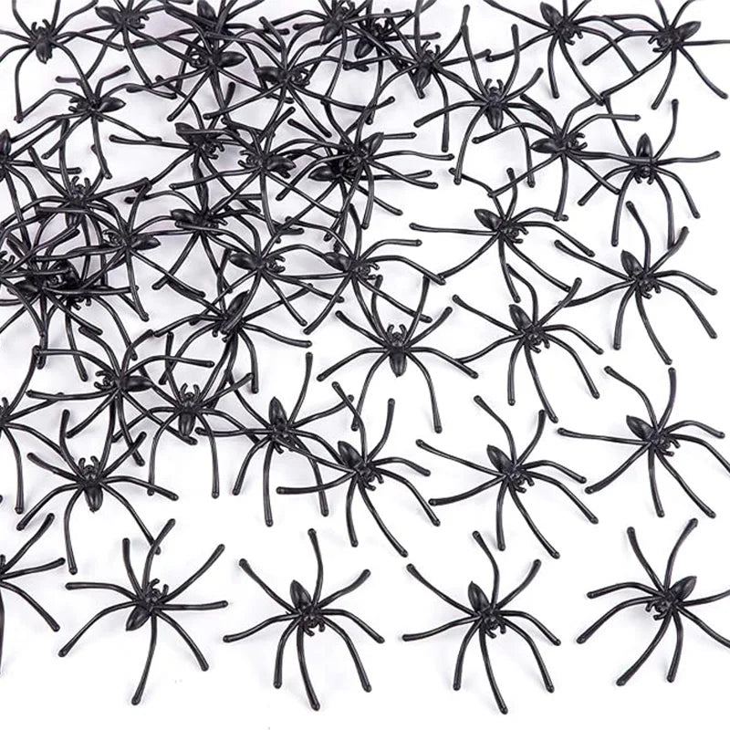 A pile of realistic mini plastic spiders for Halloween decor and pranks.