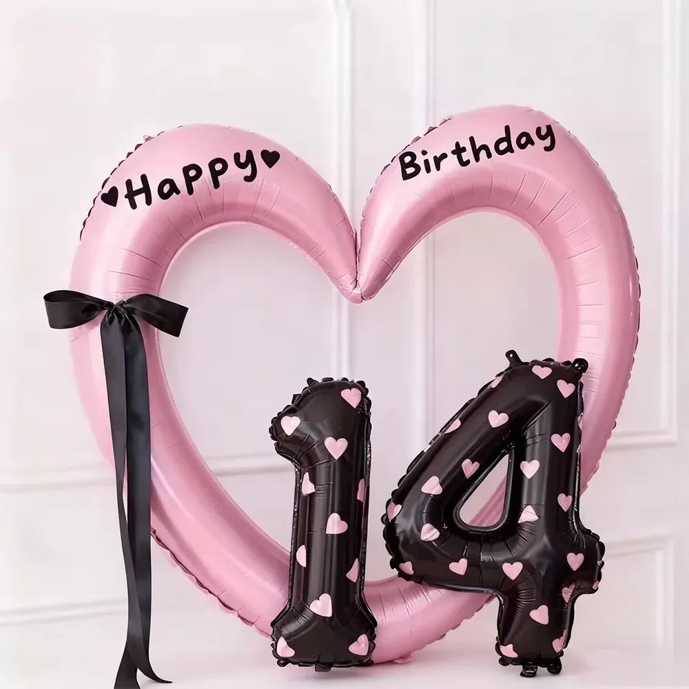 Pink foil heart balloon decoration shaped like the number 4 with happy and birthday text