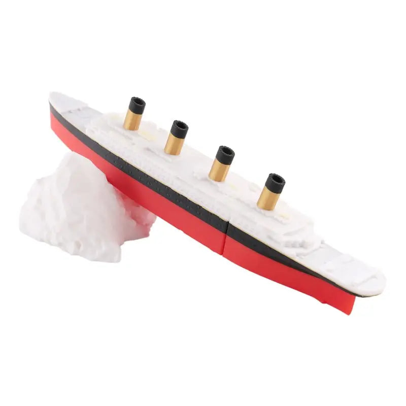 A red and white split Titanic bath and pool toy with brass cannons on top.