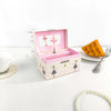 A pink wooden box with an open lid displaying a ballet figurine and jewelry storage inside.