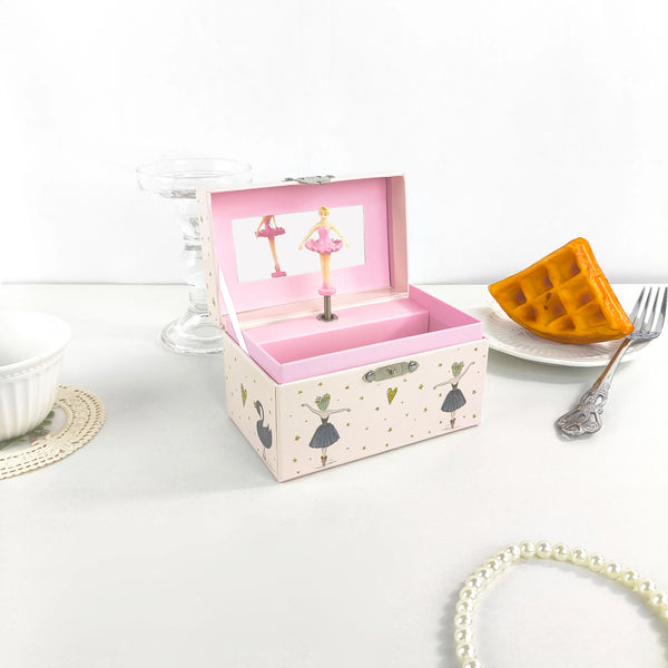 A pink wooden box with an open lid displaying a ballet figurine and jewelry storage inside.