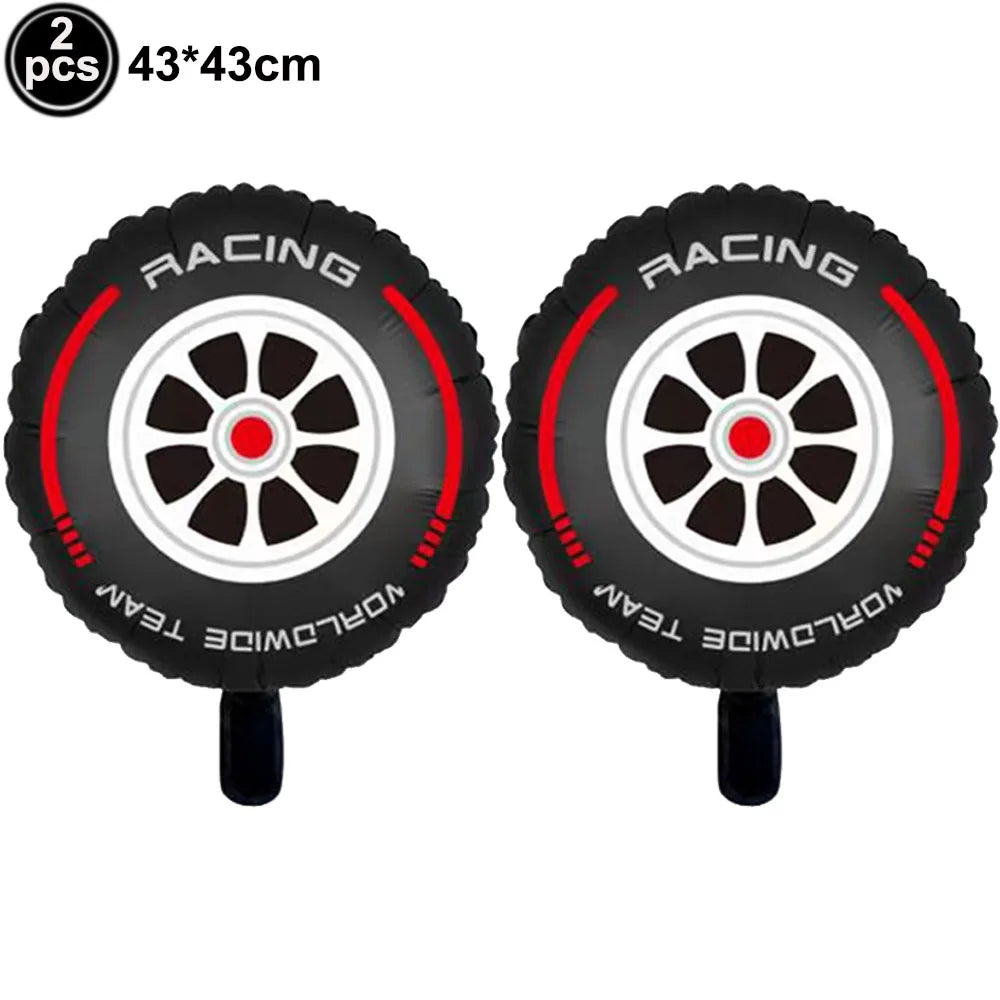 Two black racing themed balloons with white wheels and red accents for party decorations