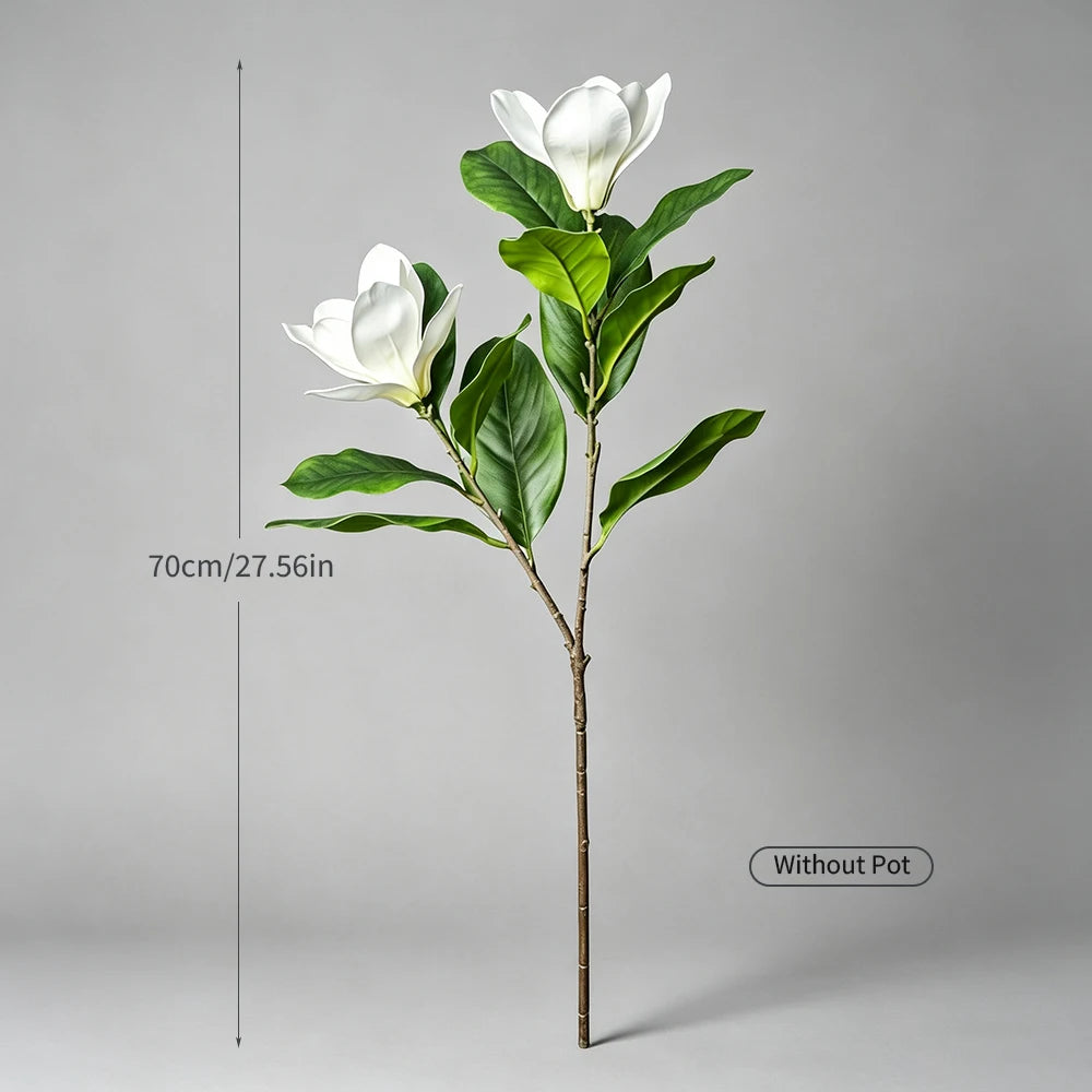 A tall artificial magnolia tree with white silk flowers on a slender stem, shown without a pot.