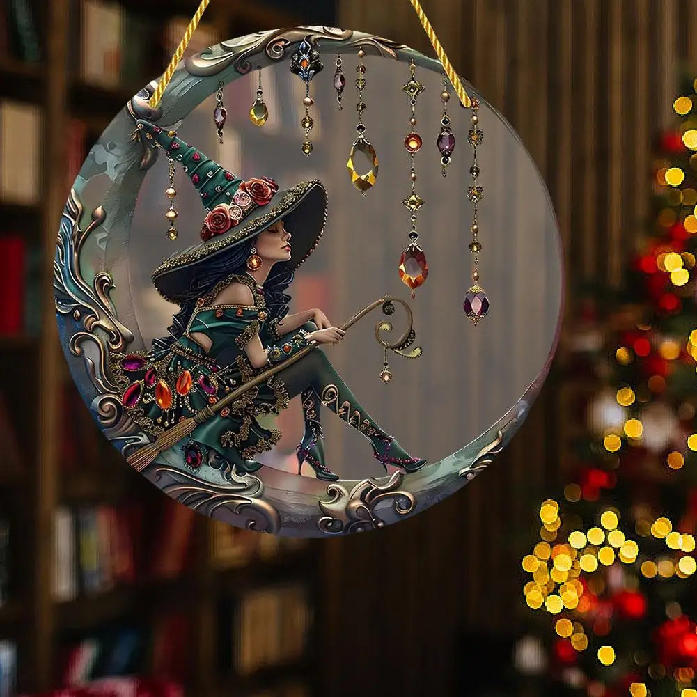 A decorative stained glass window featuring a witch figure in a pointed hat and costume, hanging with gold chains.