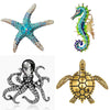 A set of vintage marine life broach pins featuring a starfish, a seahorse, a spider, and a turtle.