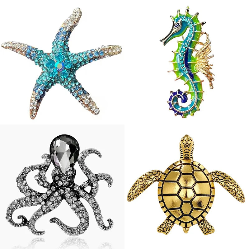 A set of vintage marine life broach pins featuring a starfish, a seahorse, a spider, and a turtle.