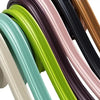 Roll of self-adhesive flexible wall skirting strips in various colors like black, green, and beige.