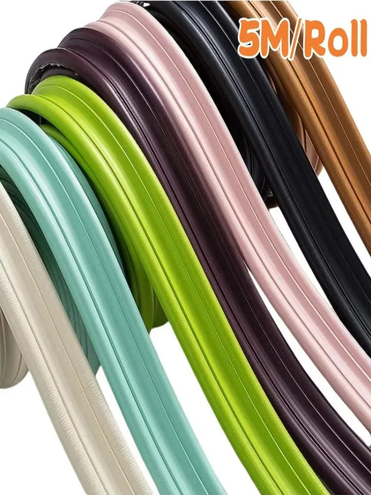 Roll of self-adhesive flexible wall skirting strips in various colors like black, green, and beige.