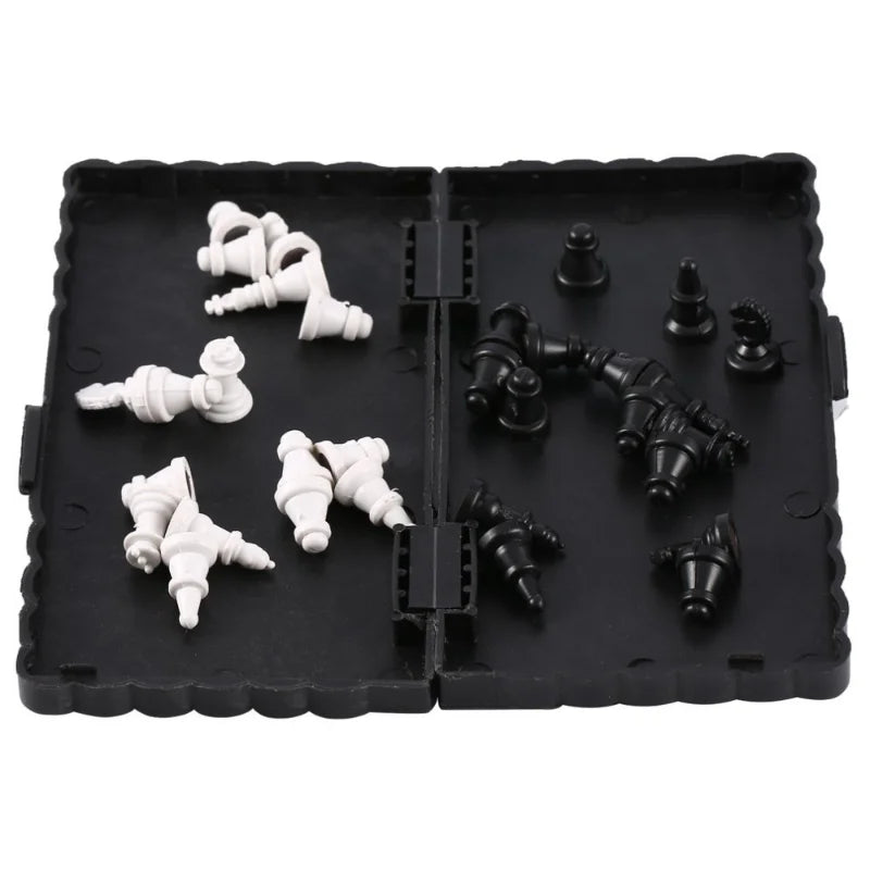 A black portable folding magnetic chess set with white pieces and a board.