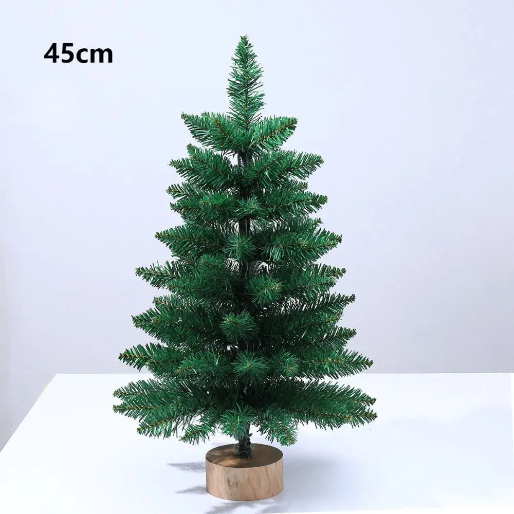 A 45cm artificial green pine tree with a warm glow displayed on a wooden base.