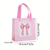 Pink and white checkered gift bags with pink bows and heart cutouts