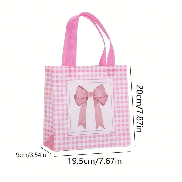 Pink and white checkered gift bags with pink bows and heart cutouts