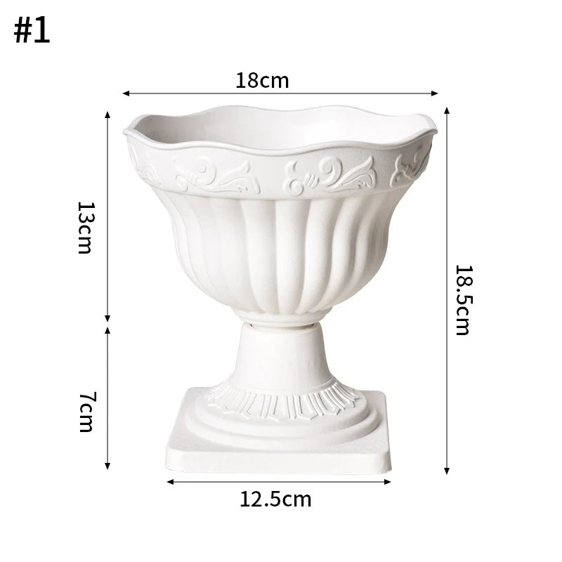 White plastic decorative vase with a flared bowl and pedestal base.