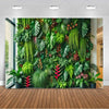 A lush green tropical palm leaf backdrop featuring various ferns and foliage for party decor.