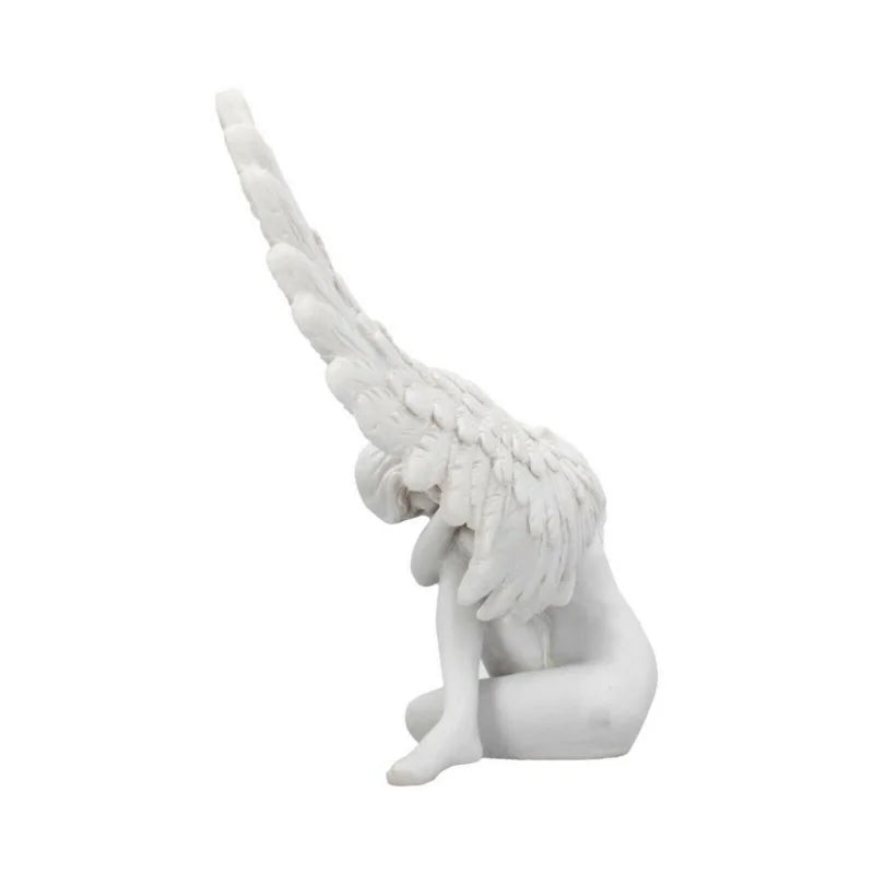 White resin angel wing figurine with delicate feathers.