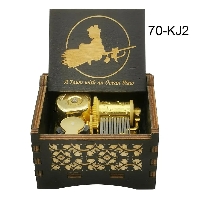 A wooden music box with a gold-colored mechanism and an engraved silhouette of a figure on the lid.