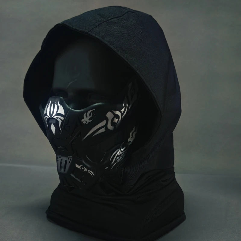 A black tactical silicone half-face mask is displayed against a gray background.