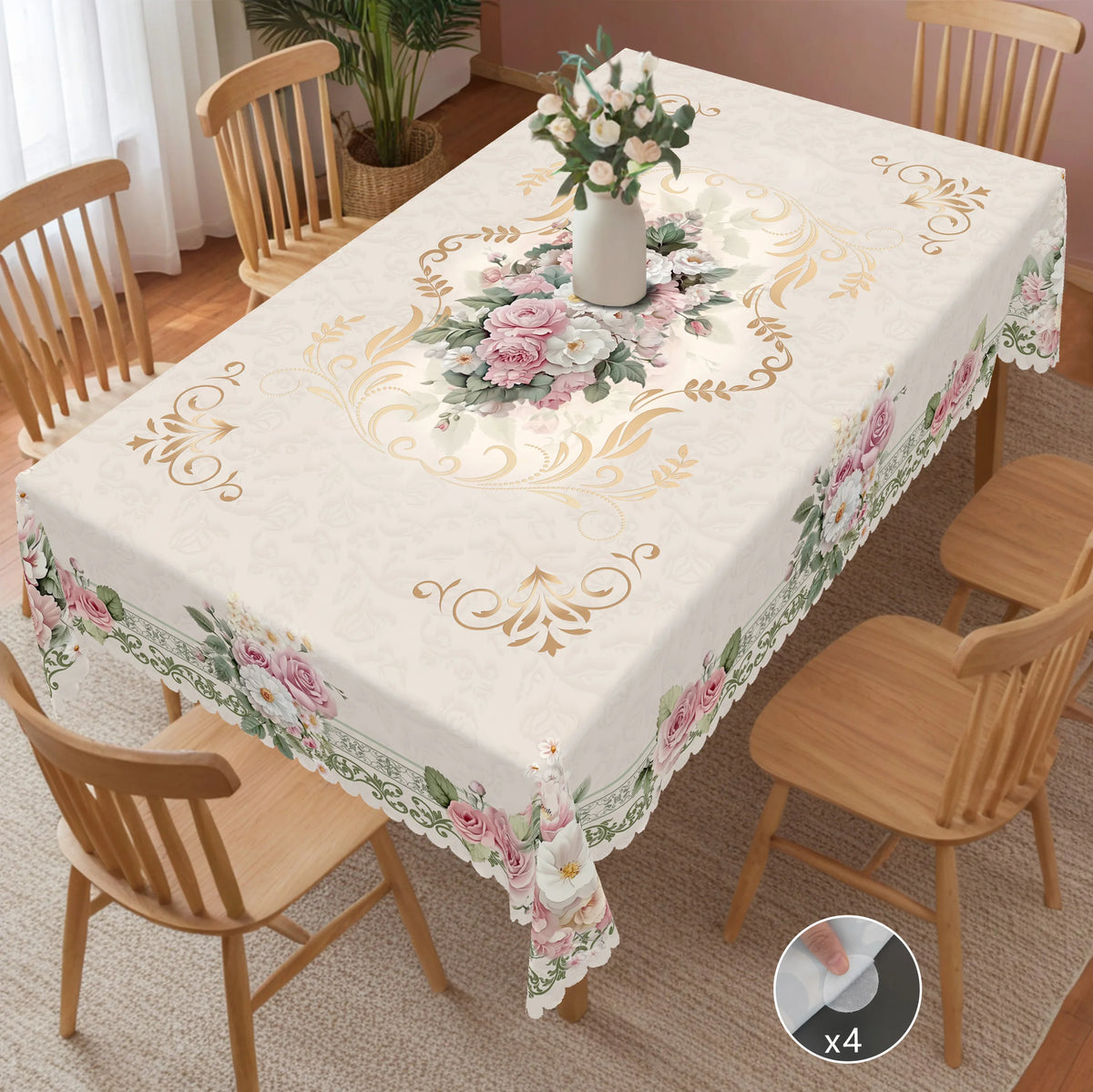 Vintage French floral tablecloth featuring beige, rose, and daisy prints on a dining table set.